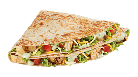 Two quarter-circle tortilla sandwiches filled with diced tomato, lettuce, cheese, chicken chunks, and ranch dressing. The avocado is not visible, but is probably in there.
