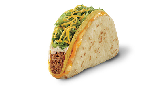 A soft taco tortilla covered in cheese and wrapped around a hard shell beef taco.