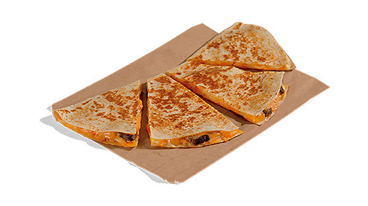 A steak quesadilla cut into four pieces.