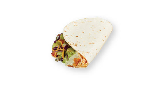 A soft shell taco filled with chicken, avocado ranch, lettuce, diced tomato, and cheese.