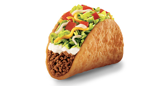 A taco-shaped object filled with ground beef, sour cream, lettuce, tomato, and cheese.