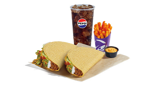 2 hard shell tacos with a side of fries and cheese sauce plus a soda.