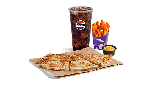 A chicken quesadilla with a side of fries and cheese sauce plus a soda.