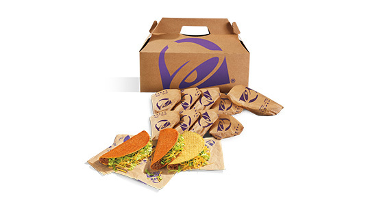 A box filled with 11 distressingly orange hard shell tacos and 1 regular hard shell taco.