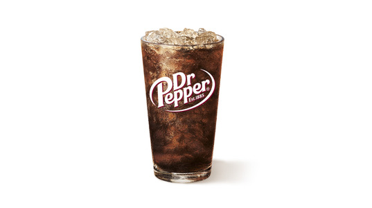 A glass of weirdly opaque soda.