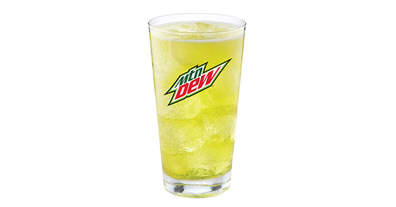 A different glass of sickly yellow soda with the old Mountain Dew logo on it.